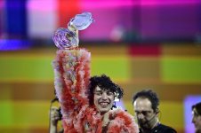 switzerland-s-nemo-lifts-up-the-eurovision-trophy-as-winner.jpg
